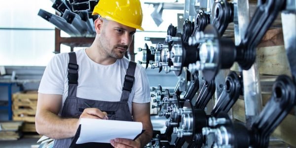 industrial-employee-wearing-uniform-yellow-hardhat-checking-production-factory_342744-185